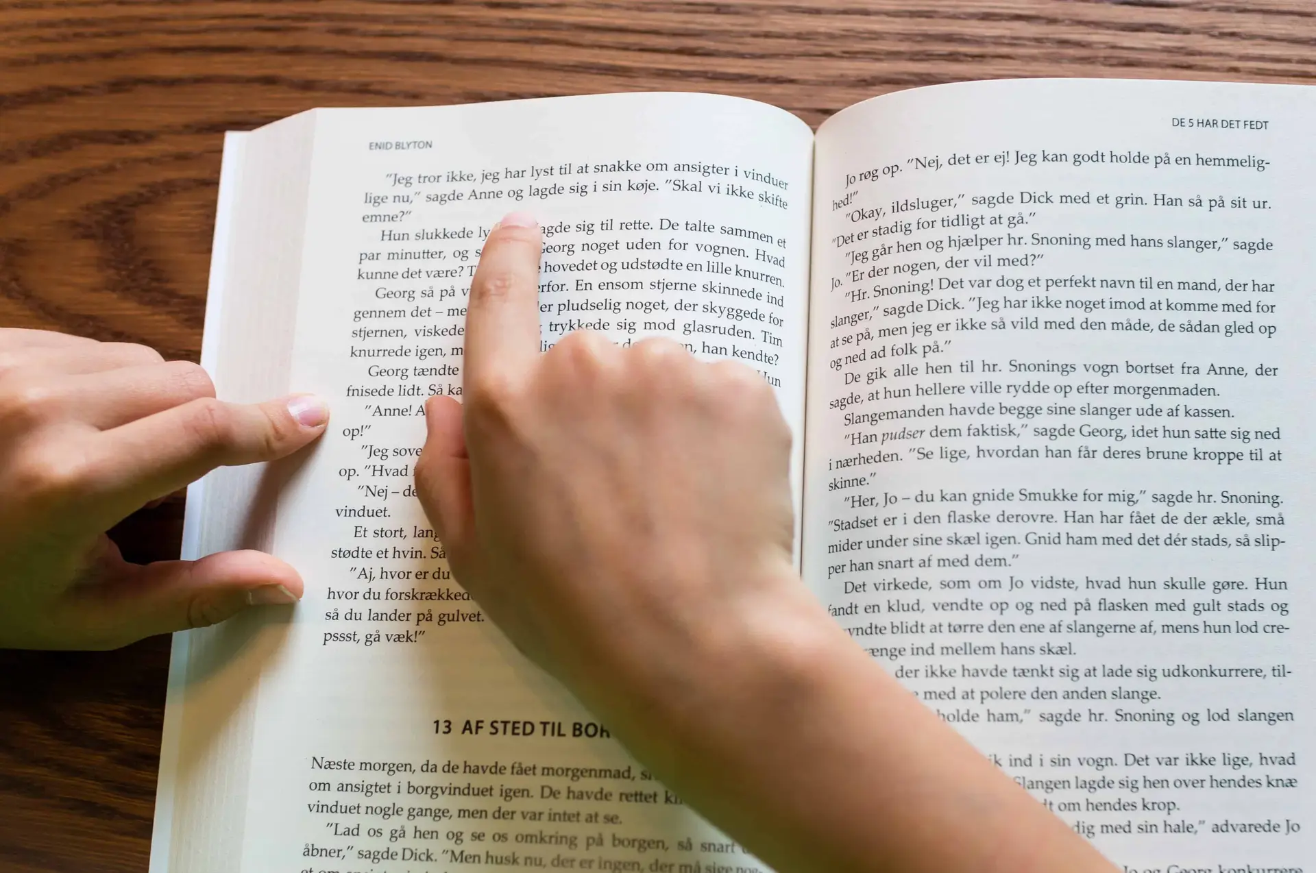 Close-up of person reading a book