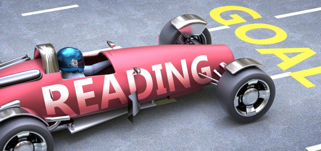 red toy racecar with the word reading on it to head the blog on struggling readers and fluency